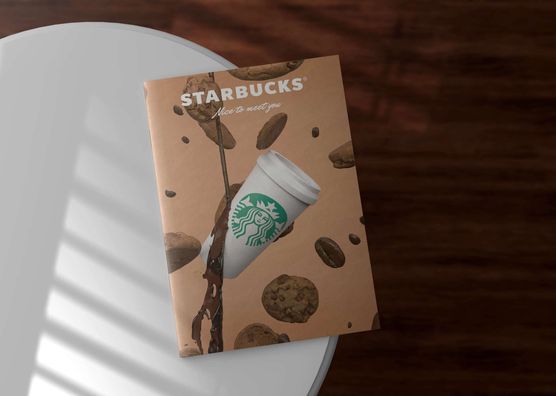 Mockup de una revista con el diseño 3D del Starbucks